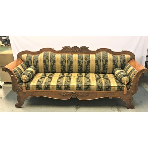 661 - BIEDERMEIER SATIN WOOD SOFA
with a shaped carved back above shaped arms, with a padded back and stuf... 