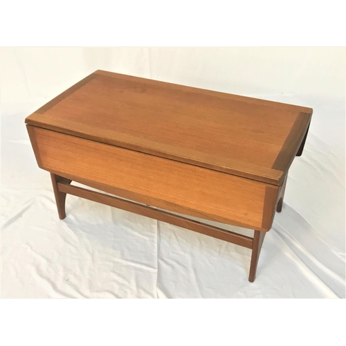 664 - STONEHILL TEAK OCCASIONAL TABLE
with an oblong top and shaped drop flaps, standing on shaped support... 