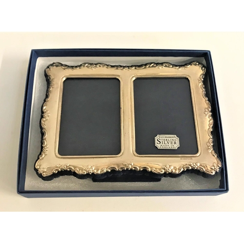 211 - SILVER DOUBLE PHOTOGRAPH FRAME
with embossed floral decoration to the shaped edges, on easel support... 