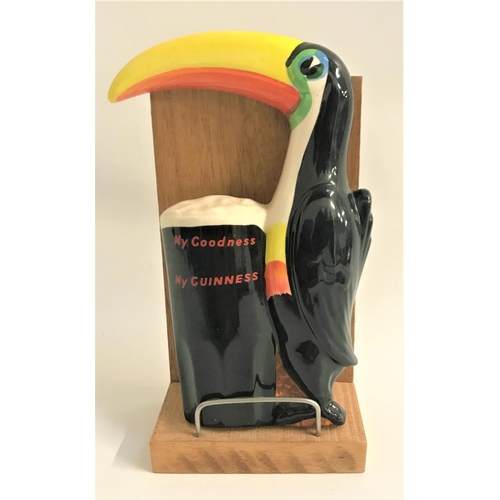 240 - CARLTON WARE GUINNESS SAVERTISING TOUCAN
with a pint of Guinness, 18.5cm high, together with a later... 