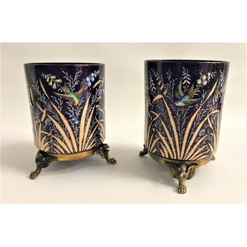 263 - PAIR OF COBALT BLUE GLASS VASES
of tubular form, decorated with birds and foliage, raised on gilt me... 