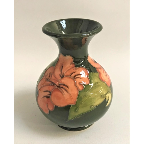 268 - MOORCROFT HISBISCUS VASE
with a green ground, 13cm high