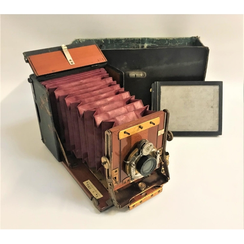 364 - JUNIOR SANDERSON QUARTER PLATE CAMERA
with a Beok Symmetrical Lens, with plate holders and a fitted ... 