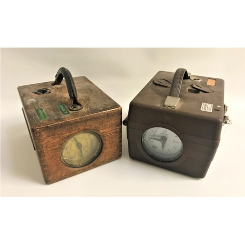 366 - TWO RACING PIGEON CLOCKS
Both with original seals, one in an oak case, the other a Benzing Quartz pl... 