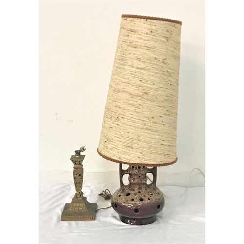 295 - WEST GERMAN POTTERY LAMP
with pierced decoration, side handles and brown glazed body, with a hessian... 