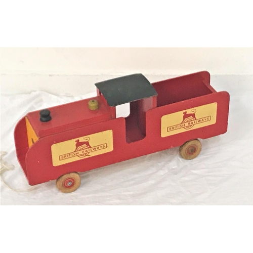 443 - VINTAGE BRITISH RAILWAYS PULL ALONG WOODEN TOY TRAIN
the red and yellow painted body on wooden wheel... 