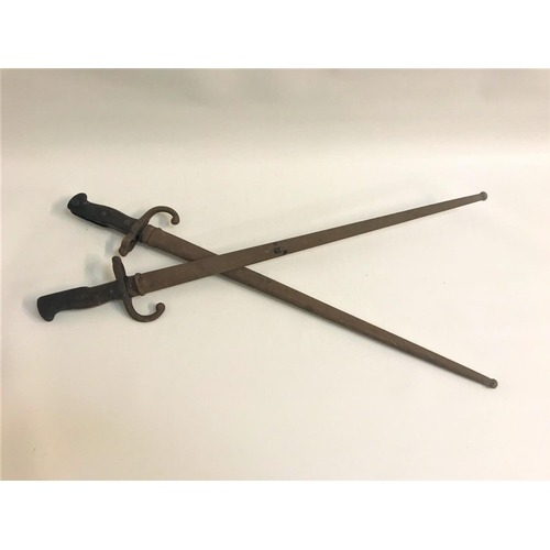 499 - TWO FRENCH BAYONETS
1874 model Gras sword bayonet, each with a brass pommel with internal latching m... 