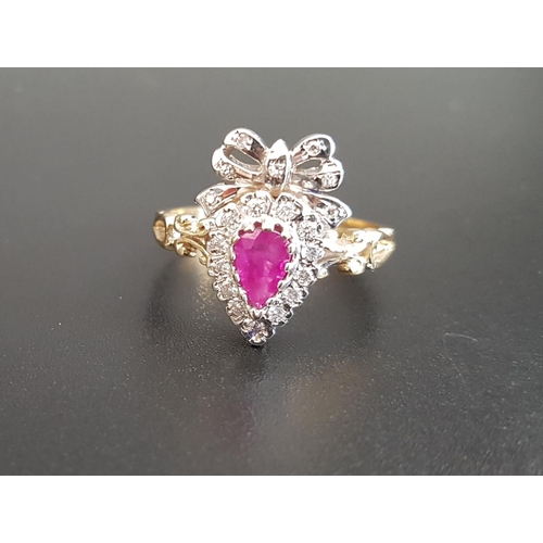 64 - UNUSUAL RUBY AND DIAMOND CLUSTER RING
the pear cut ruby in diamond surround and surmounted by a diam... 