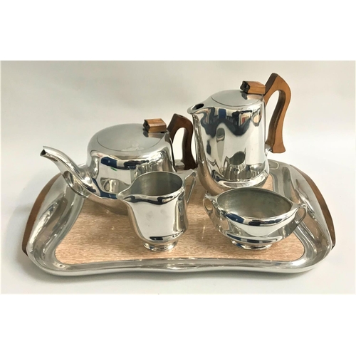 313 - PICQUOT WARE TEA SERVICE
comprising a tea pot, hot water jug, milk jug, oval sugar bowl and tray (5)