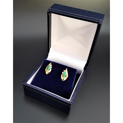 101 - PAIR OF EMERALD AND DIAMOND STUD EARRINGS
the marquise emeralds and round cut diamonds in shaped nin... 