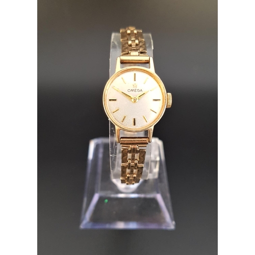 76 - LADIES 1960s OMEGA NINE CARAT GOLD CASED WRISTWATCH
the champagne dial with five minute baton marker... 