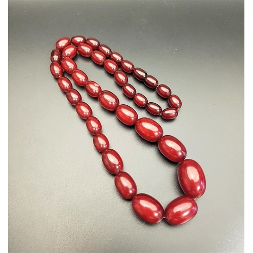 113 - GRADUATED CHERRY AMBER COLOURED BEAD NECKLACE
40 grams and approximately 53cm long