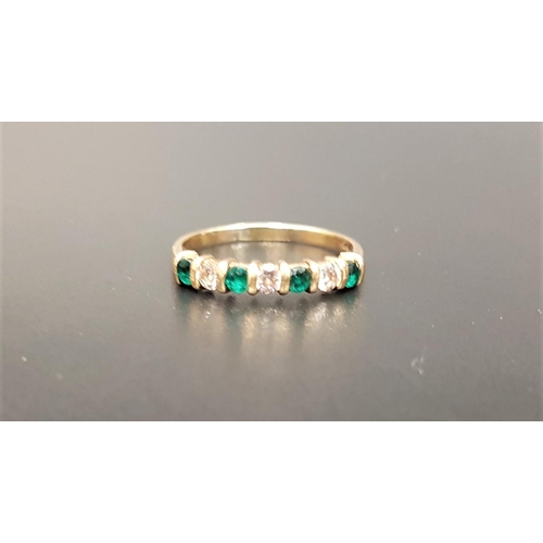 143 - DIAMOND AND EMERALD SEVEN STONE RING
set with alternating diamonds and emeralds, the three diamonds ... 