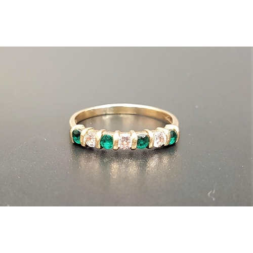 143 - DIAMOND AND EMERALD SEVEN STONE RING
set with alternating diamonds and emeralds, the three diamonds ... 