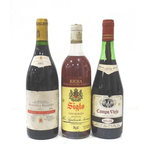 697 - SELECTION OF THREE BOTTLES OF RIOJA
comprising: one Campo Viejo Rioja 1979 Vintage (70cl) approx. 5c... 