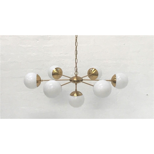 406 - SIX BRANCH PENDANT LIGHT
with opaque circular glass shades and brass effect suspension chain, and wi... 