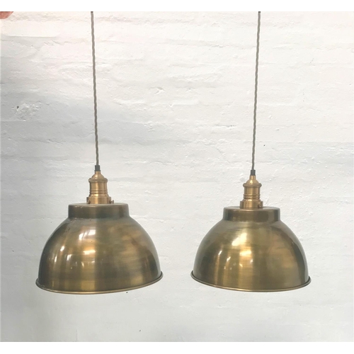 411 - PAIR OF ANTIQUE BRASS EFFECT INDUSTRIAL PENDANT LIGHTS
with domed shades and one with interior textu... 