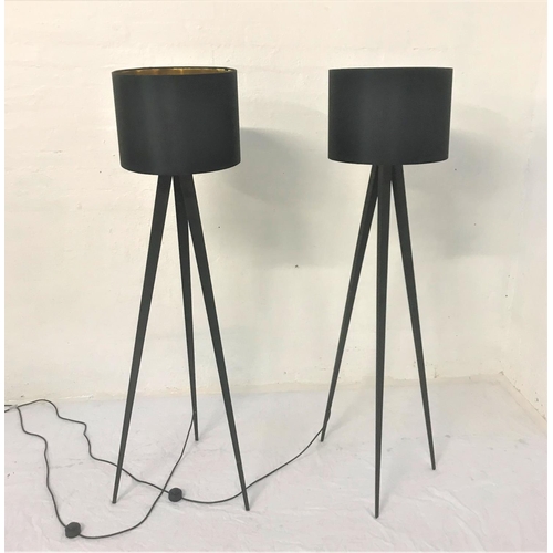 414 - PAIR OF BLACK STEEL TRIPOD FLOOR LAMPS
with circular black hessian shades with gold interior, 152.5c... 