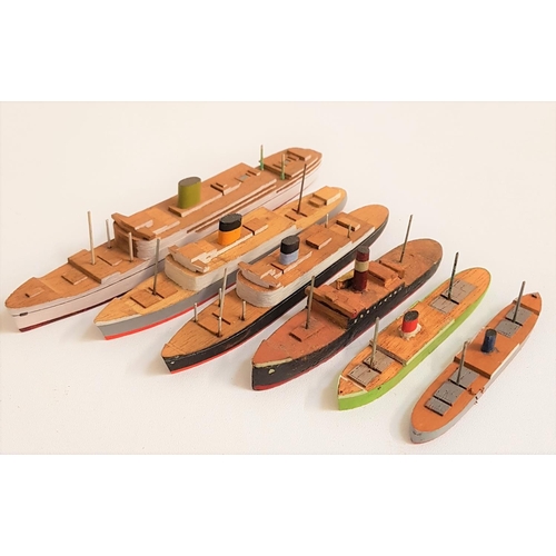 322 - FIFTY SEVEN HAND BUILT SHIPS
in mahogany and most painted, including cruise ships, paddle steamers, ... 