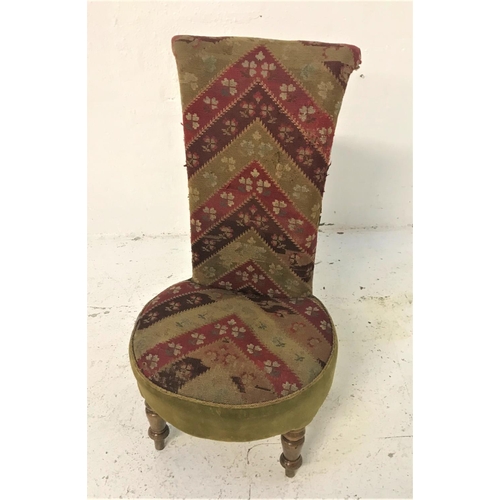 387 - LATE VICTORIAN PRIE DU CHAIR
with a tall shaped back above a circular seat, covered in a chevron nee... 