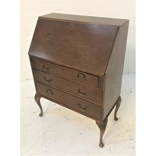 403 - MAHOGANY AND CROSSBANDED BUREAU
the fall flap opening to reveal a fitted interior above three cockbe... 