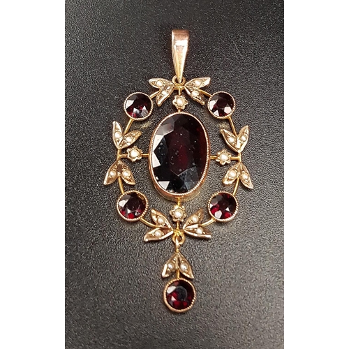 96 - ATTRACTIVE EDWARDIAN GARNET AD SEED PEARL PENDANT
the central oval cut garnet in round garnet and se... 