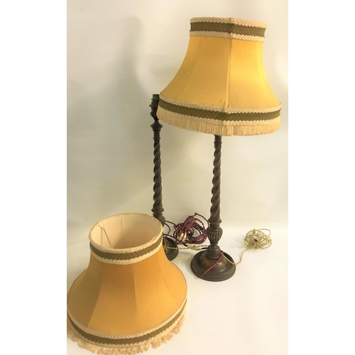 773 - PAIR OF MAHOGANY TABLE LAMPS
raised on circular bases with barley twist columns and urn shaped finia... 