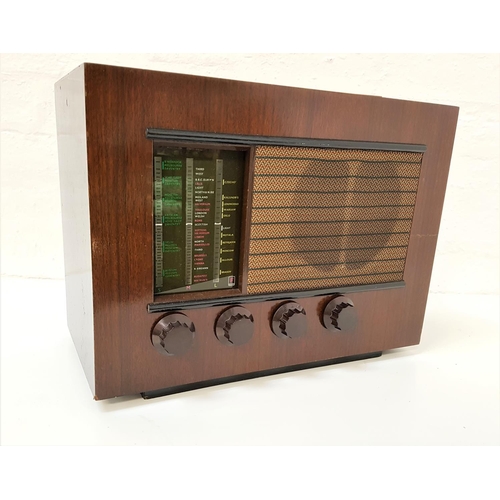 308 - FERRANTI 105 RADIO
in a stained case with a glass tuning dial and speaker above four bakelite knobs,... 