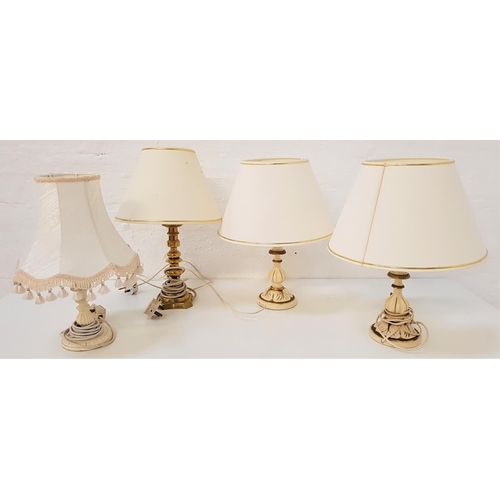 761 - PAIR OF TABLE LAMPS
raised on cream painted circular bases with turned columns with gilt highlights,... 