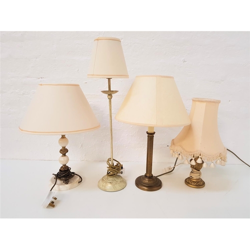 762 - MARBLE AND GILT METAL TABLE LAMP
raised on a circular base with a cream shade, 41.5cm high, metal an... 