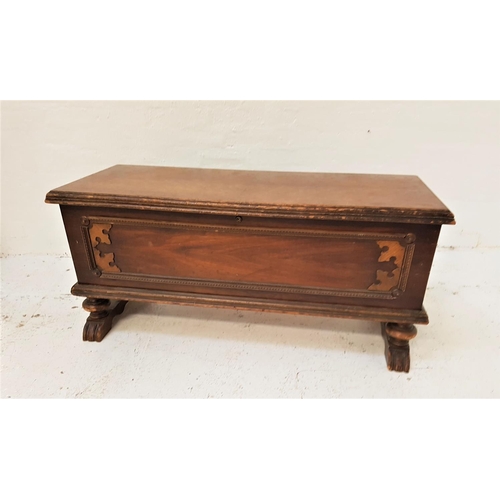 766 - MAHOGANY BLANKET CHEST
with a lift up moulded lid above a panelled front, standing on turned stout f... 