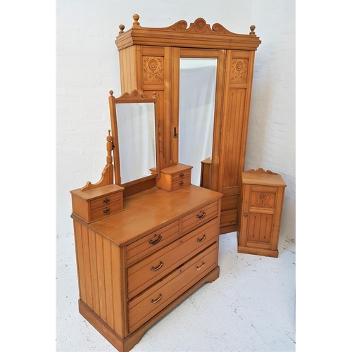 768 - EDWARDIAN LIGHT OAK BEDROOM SUITE
comprising a wardrobe with an arched carved pediment above a centr... 