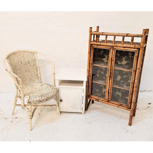 769 - BAMBOO DISPLAY CABINET
with a three quarter galleried top above a pair of glass doors, 104cm high, t... 