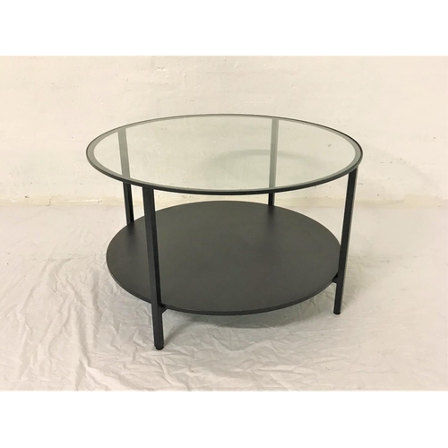 609 - CIRCULAR METAL OCCASIONAL TABLE
with inset glass top, standing on plain supports united by an undert... 