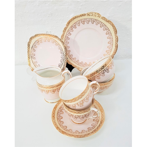 148 - TAYLOR & KENT LONGTON TEA SERVICE
with a white and pale pink ground with gilt highlights, comprising... 