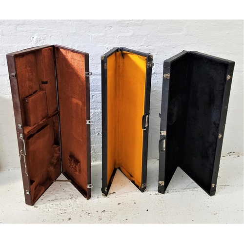 424 - THREE HARD SHELL INSTRUMENT CASES
two with fitted faux fur interiors for guitars; and another unfitt... 