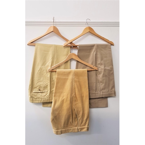 399 - THREE PAIRS OF GENTLEMEN'S DESIGNER TROUSERS
comprising Barbour yellow cords, 36