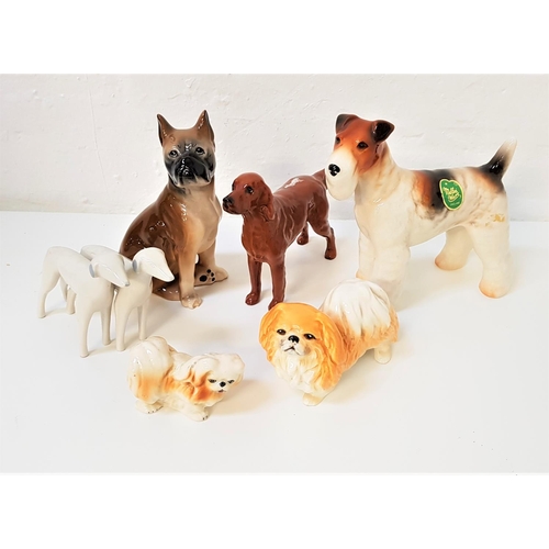 187 - SIX VARIOUS CERAMIC DOG ORNAMENTS
including a Beswick red setter marked 'CH. Sugar of Wendover', a M... 