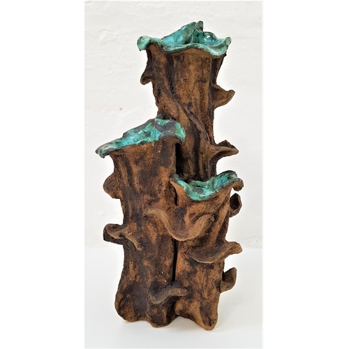 150 - CLIVE BROOKER STUDIO POTTERY VASE
with three brown bark sections with blue interiors stems, the base... 