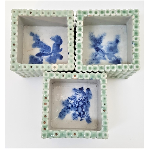 155 - THREE CHINESE PORCELAIN SQUARE PLANTERS
decorated as square bamboo planters, the interiors painted w... 