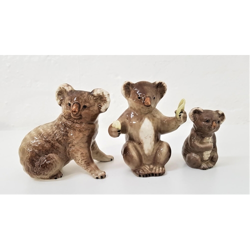 184 - THREE BESWICK KOALAS
one holding a eucalyptus leaf and numbered 1089 and a small example numbered 10... 