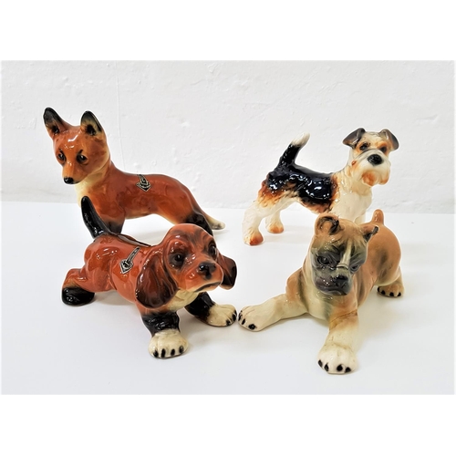 186 - FOUR GERMAN DOG FIGURINES
makes include Goebel and Cortendorf, the largest 11.3cm high (4)