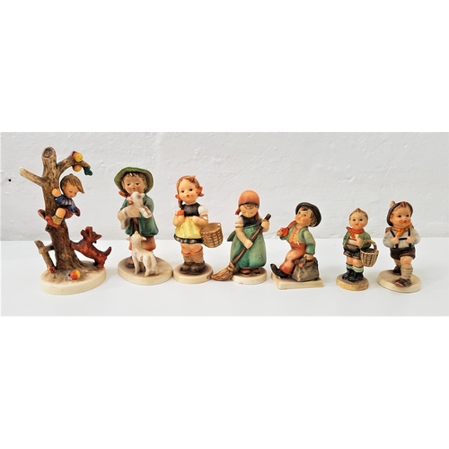 190 - SEVEN GOEBEL HUMMEL FIGURES
including a boy climbing an apple tree with dog at base, a girl sweeping... 