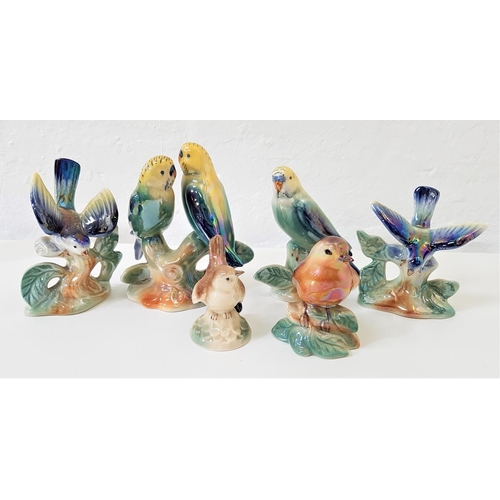 200 - SIX CAMPSIE WARE LUSTRE WARE FIGURINES
including two blue tits, budgie, robin, wren and a pair of bu... 