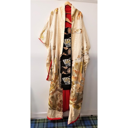 386 - IMPRESSIVE EMBROIDERED SILK KIMONO
with gold and other metallic embroidered decoration on a cream si... 