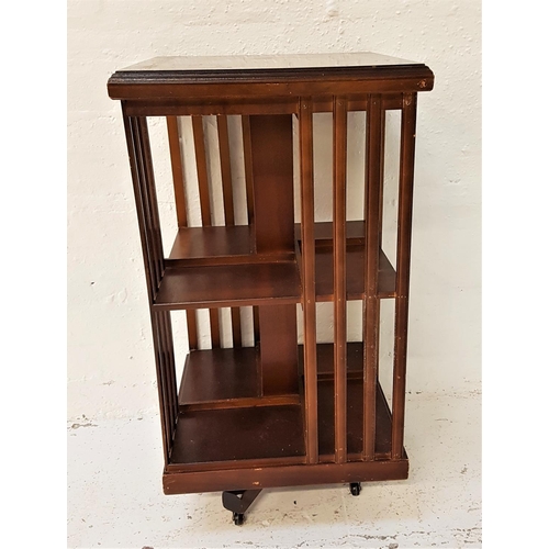 639 - MAHOGANY AND INLAID REVOLVING BOOKCASE
with a square moulded top above open and slatted sides with t... 