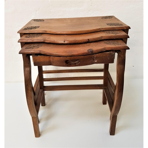 650 - NEST OF D SHAPED TEAK TABLES
with carved floral decoration, the smallest table with a frieze drawer,... 