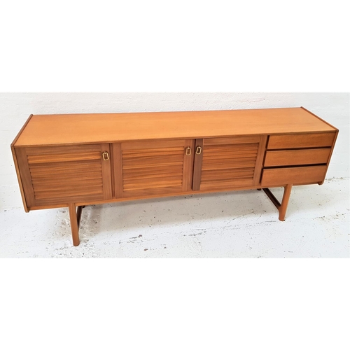 667 - McINTOSH AND CO TEAK SIDEBOARD
with a plain top above three cupboard doors and three drawers, standi... 