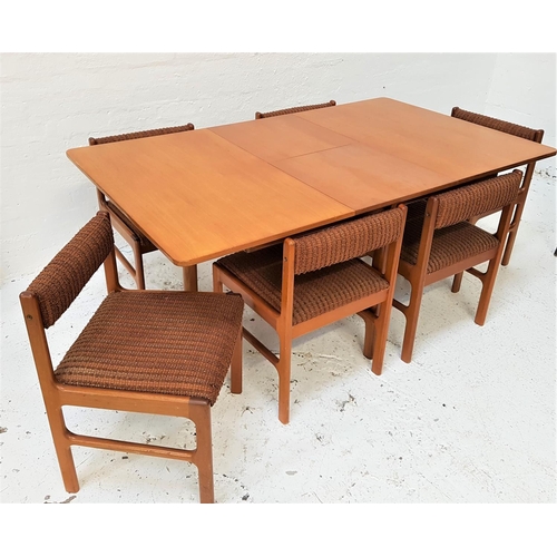 668 - McINTOSH AND CO TEAK DINING TABLE AND CHAIRS
the table with a pull apart top and fold out leaf, stan... 