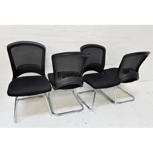 620 - SET OF FOUR OFFICE CHAIRS
with shaped mesh fabric backs above black fabric padded seats, standing on... 